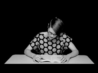 girl reading a book while sitting on a vibrator 2