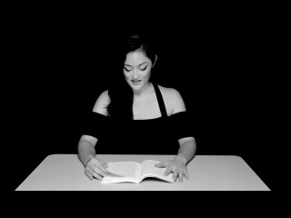 actress reading a book while sitting on a vibrator